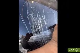 ویدئو |  اقدام جنون‌آمیز یک جوان و خسارت شدید به خودروی لوکسش