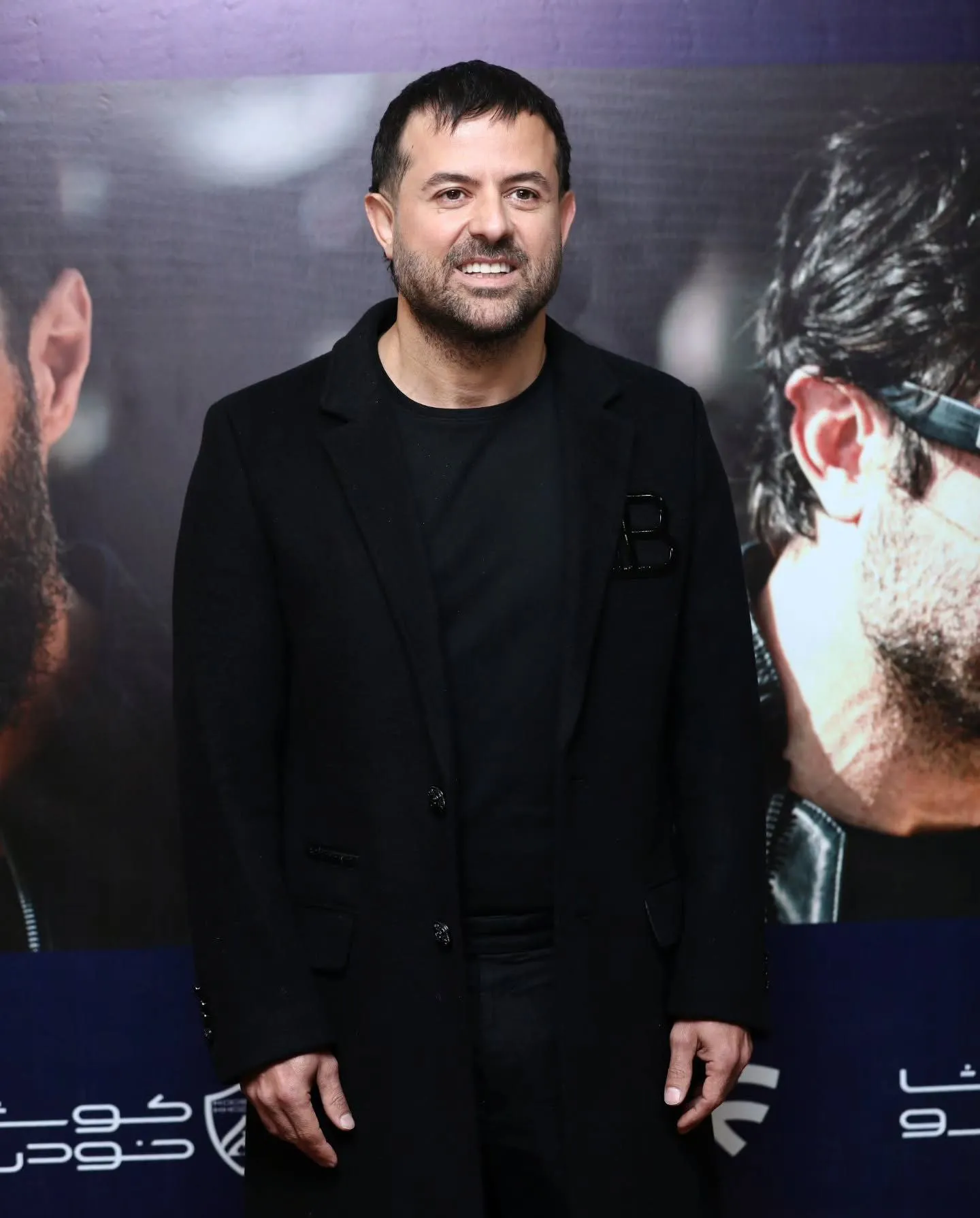 هومن سیدی با لباس سیاه